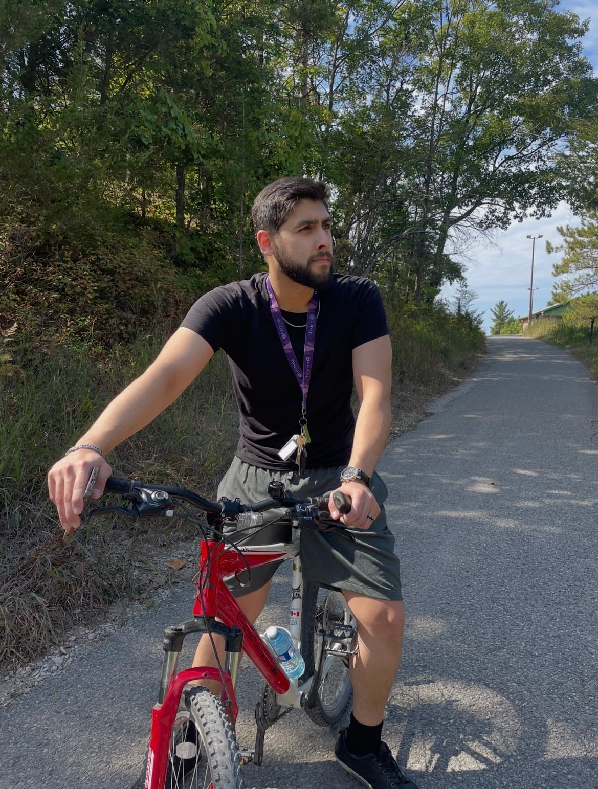 Sami Qureshi riding a bike on a trail